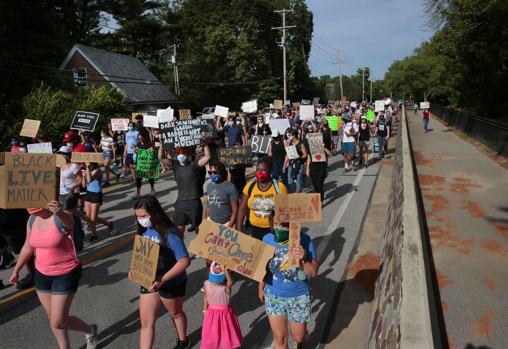 Youth march moves through wealthy suburbs